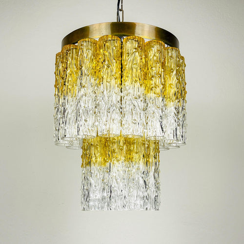 Chandelier with gold and clear glass design on a neutral background
