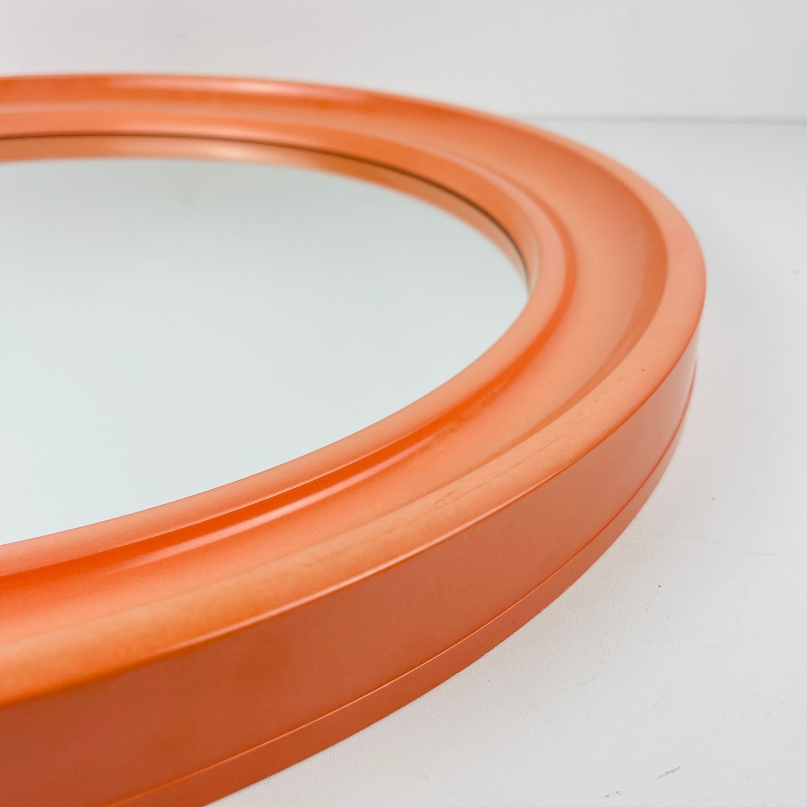 Mid-century orange bakelite mirror Carrara & Matta model America Italy 1970